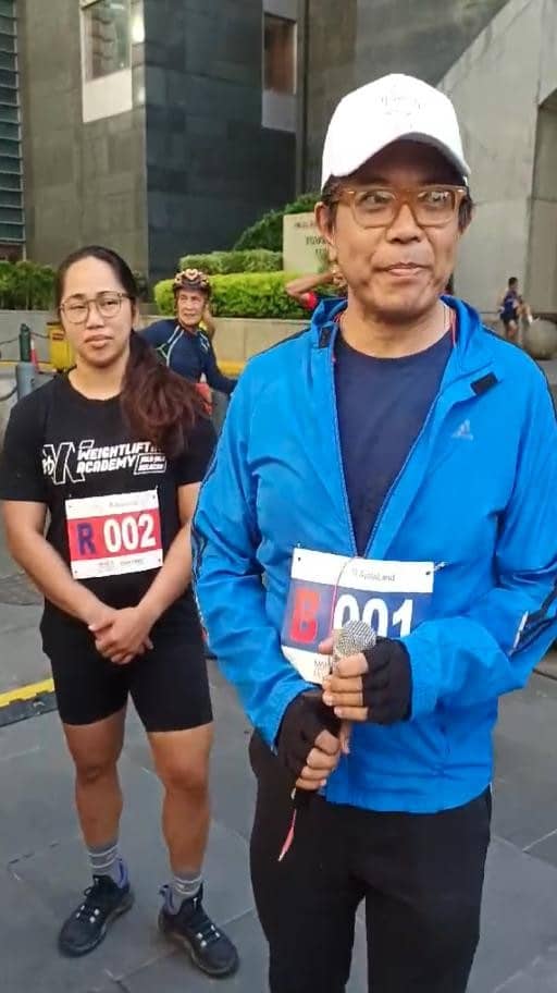 Martin Macalintal, Cultural Attaché, Embassy of France and Micronesia, with weightlifting champ Hidilyn Diaz Naranjo, the first Filipino to ever win an Olympic gold medal for the country, at the French Market on Sunday, 2 June 2024.